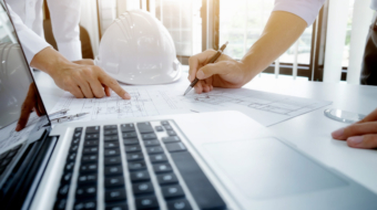 Image of engineer meeting for architectural project. working with partner and engineering tools on workplace vintage tone.