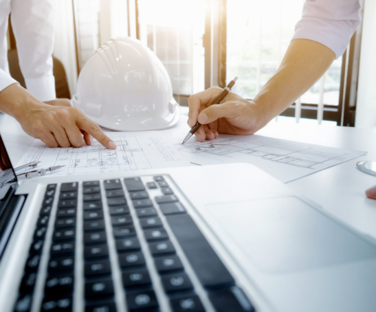 Image of engineer meeting for architectural project. working with partner and engineering tools on workplace vintage tone.